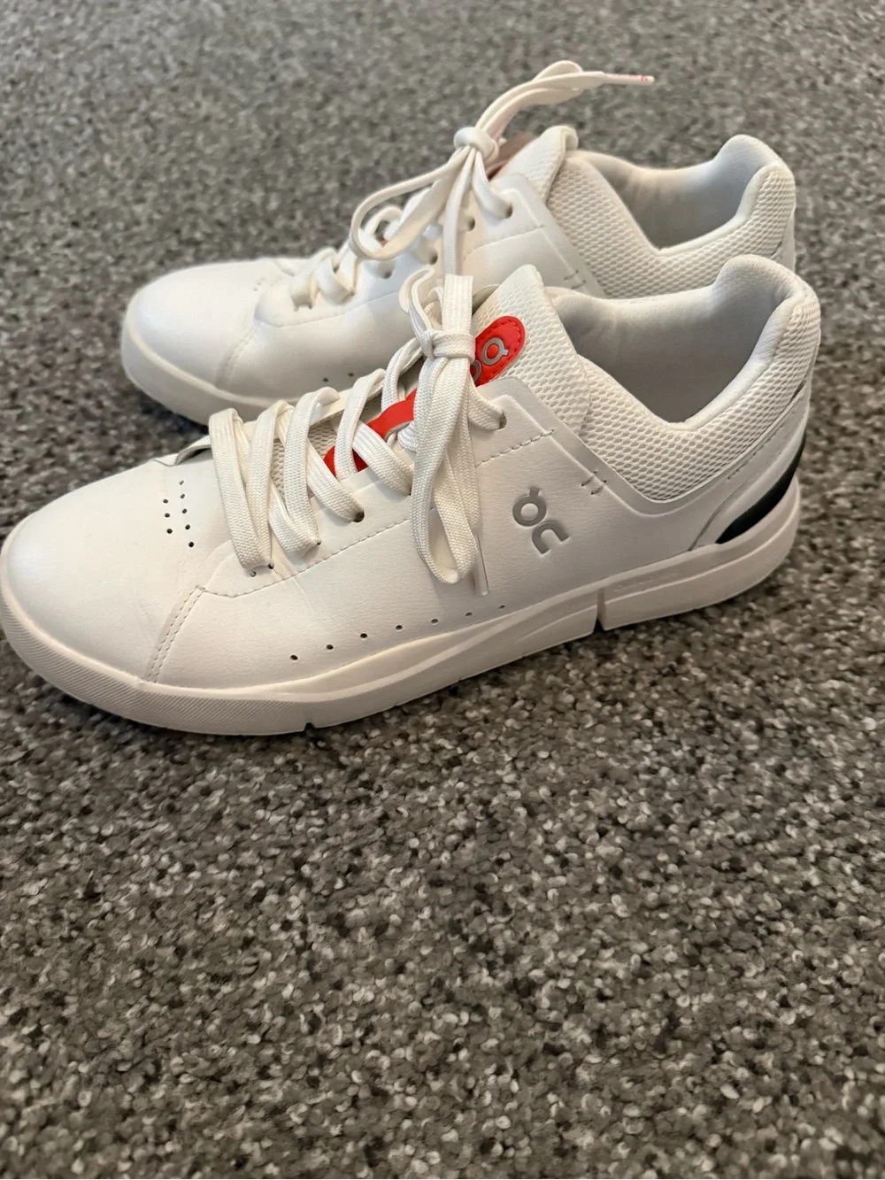On Running White Sneakers with Red Accent